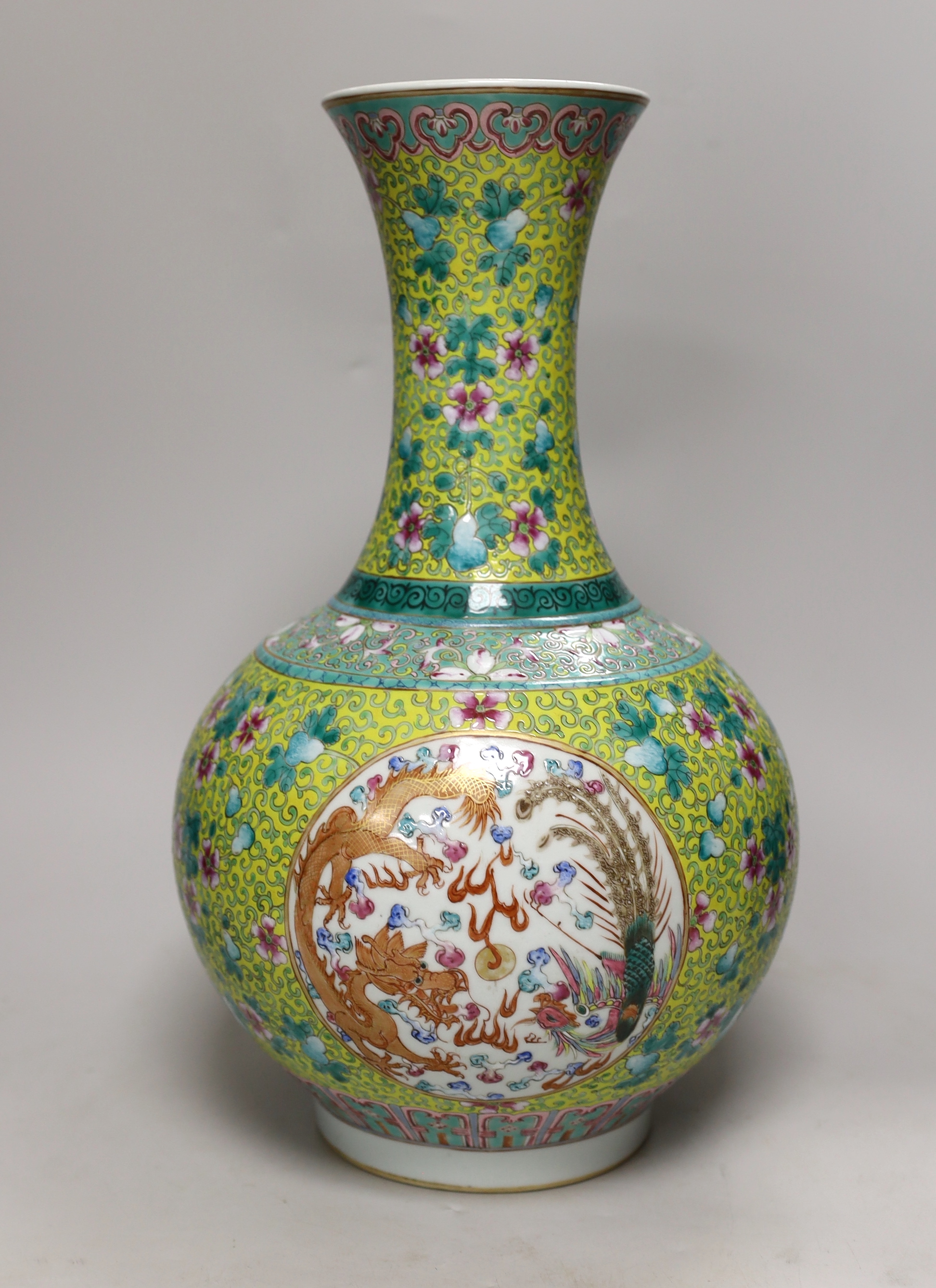 A large Chinese yellow ground ‘dragon & phoenix’ vase, 39cm high